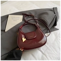 Minimalist burgundy semi-circular crossbody bag with glossy patent leather and gold heart charm - Burgundy