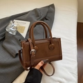 Brown rectangular crossbody bag with circular handle and elegant leather texture - Brown No Pendant