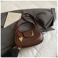 Elegant deep burgundy hobo bag in glossy leather with a golden heart pendant - Brown
