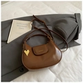 Chic dark brown crescent crossbody bag with glossy finish and gold heart charm - Brown