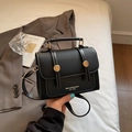 Chic black crossbody bag with white stitching and gold buckles in hand - Without Pendant / Black