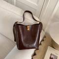 Deep brown vintage faux leather bucket bag with gold lock and embossed logo detail - Coffee without Pendant