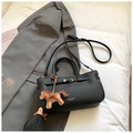 Minimalist black pebble leather handbag with horse charm and adjustable shoulder strap - With Charm / Black