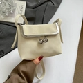 Elegant off-white lychee grain mini crossbody bag with vintage silver metal frame and bead clasp - White