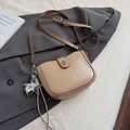 Beige faux leather crossbody square bag with silver clasp and star charms on suit jacket - Khaki with Pendant