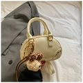 Cream vintage bowling handbag with plush bear charm and golden ring hardware accents - With Charm / White