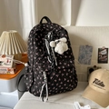 Quilted black backpack with pink bow print, featuring a plush dog charm and drawstring - With Charm / Black