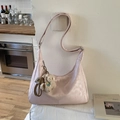 Pink faux leather tote bag with a cute sheep plush pendant hanging on a white wall - Pink with Pendant