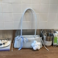 Detail of light blue PU leather underarm bag with metal logo and ribbon star pendant - Blue