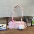 Detail of light pink shoulder bag featuring a checkered bow and star plush cat charm - Pink