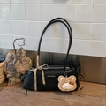 Detail of black matte underarm bag with plaid bow ribbon and cute brown plush bear charm - Black