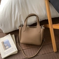 Brown litchi grain leather bucket bag with top handles and a thin shoulder strap - Brown No Pendant