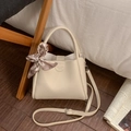 Detail of cream white bucket bag with lychee texture leather and a checkered silk scarf - White