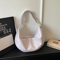 Detail view of glossy lilac hobo bag with smooth finish and high-quality wide shoulder strap - Purple