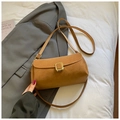 Minimalist brown square crossbody bag with gold buckle on a stylish suit backdrop - Brown