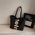 Large black canvas tote bag with white lettering and premium brown leather handles - Black