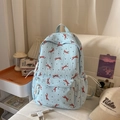 Light blue bubble texture school backpack with red bow pattern and black polka dots - Blue