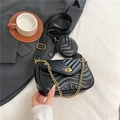 Black quilted crossbody bag with V-shaped stitching, gold chain, and round coin purse accessory - Black