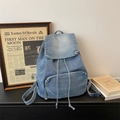Vintage light blue denim backpack with drawstring closure and front zipper pocket - Light Blue