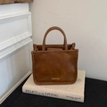 Classic brown faux leather tote bag with vintage style, double handles and gold metal logo - Brown No Pendant