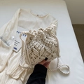 Chic cream white woven macrame bucket bag with drawstring closure and braided strap - Off-white