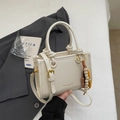 Minimalist off-white wrinkled PU leather crossbody bag with elegant wooden bead charm - Off White