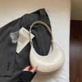 Minimalist cream-colored crescent hobo bag made of smooth leather for underarm style - Soy White