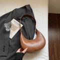 Chic brown crescent hobo bag in smooth leather finish with vintage aesthetic - Brown