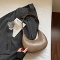 Chic brown semi-circle hobo bag made of glossy leather for women in a minimalist style - Oak Camel