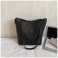 Chic black litchi grain leather bucket bag with silver metal rings and large capacity - Black
