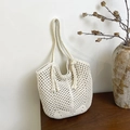 Beige handmade crochet tote bag with woven mesh design and tassel detail in a cozy home setting - Zipper Style / White Zipper Style
