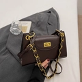 Detail of dark brown glossy leather bag with gold chain strap and vintage twist lock - Brown