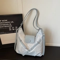 Minimalist light blue faux leather tote bag with magnetic flap and metal buckle detail - Blue Without Charm