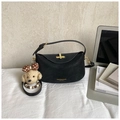 Elegant black leather crossbody bag with a gold clasp and a cute teddy bear charm - Black With Pendant