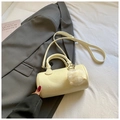 Elegant cream white Boston barrel bag with plush ball charm and adjustable strap - Yellow with Pendant