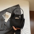Black lychee leather bucket bag with silver metal buckle and adjustable shoulder strap - Black