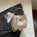 Elegant cream white lychee pattern bucket bag with silver twist lock and strap - Off White