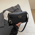 Elegant black glossy faux leather square shoulder bag with gold metal buckle detail - Black