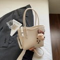 Chic cream white bucket bag in lychee leather with a cute bear charm and wavy top edge - With Charm / Off White