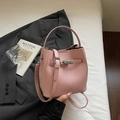 Pink lychee grain leather bucket bag with silver metal lock and crossbody strap - Pink