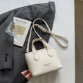 Elegant cream-colored lychee leather bucket bag with top handles and adjustable shoulder strap - Off-white Without Pendant