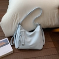 Light blue crescent tote bag in textured leather with multiple straps and silver hardware - Blue Without Charm