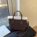 Coffee brown suede bucket bag with white faux fur trim and embossed floral patterns - Brown