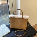 Brown vintage embossed bucket bag with white faux fur trim and dual handles - Caramel color