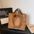 Brown canvas tote bag with Inside Out print and wide shoulder straps for daily use - Coffee
