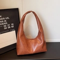 Caramel brown faux leather hobo shoulder bag with a vintage texture and wide strap - Brown