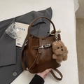 Retro dark brown bucket bag with plush bear charm and metallic buckle closure - Brown with Pendant