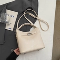 Chic cream white bucket bag featuring a metal twist lock and detachable shoulder strap - Off-white Without Pendant