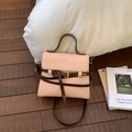 Elegant nude pink square handbag with dark brown handles and golden buckle detail - Pink
