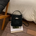 Detail of black suede bucket bag featuring silver twist lock and slim shoulder strap - No Pendant / Black